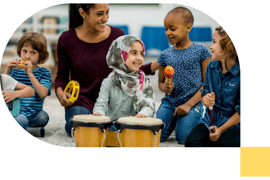 music teacher playing instruments with a group of young children